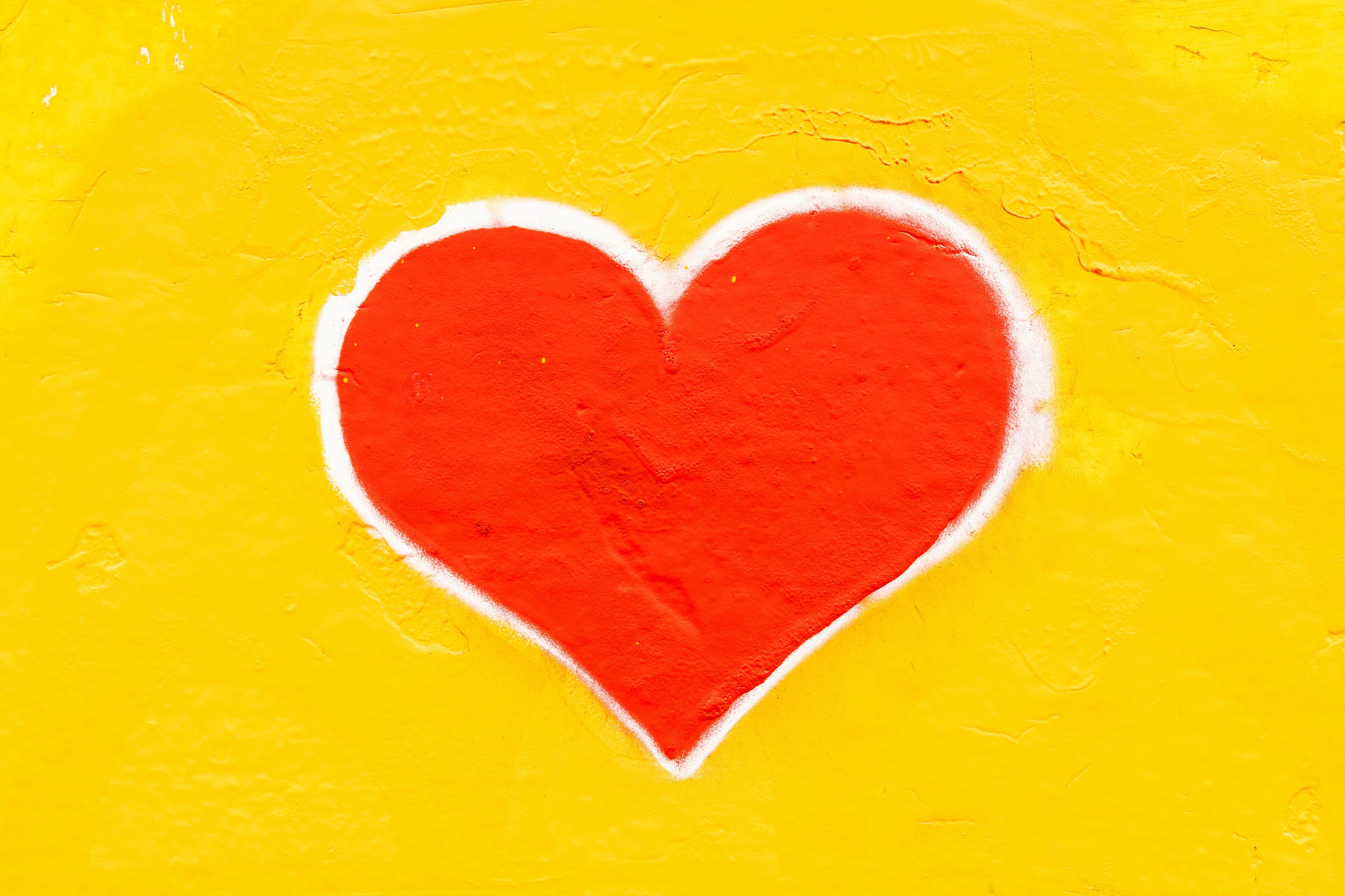Red heart on yellow background.