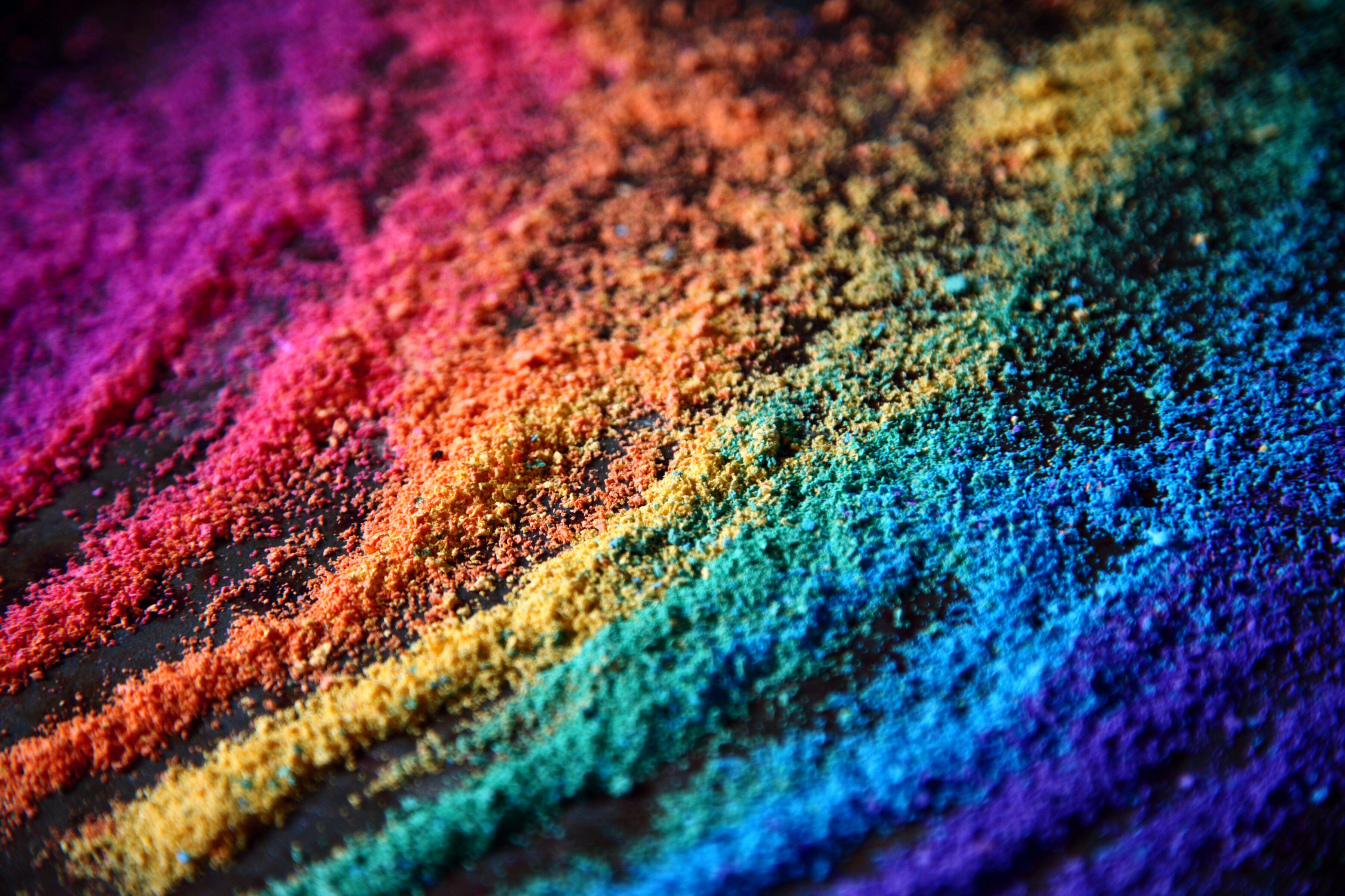 Rainbow coloured sand to represent diversity, equality and inclusion.
